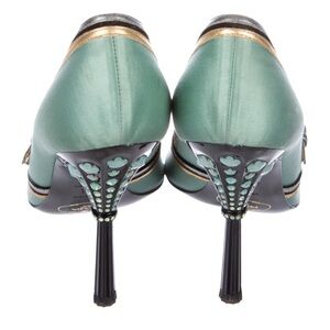 Prada peep-toe pumps with bow accent. Rare color for these model